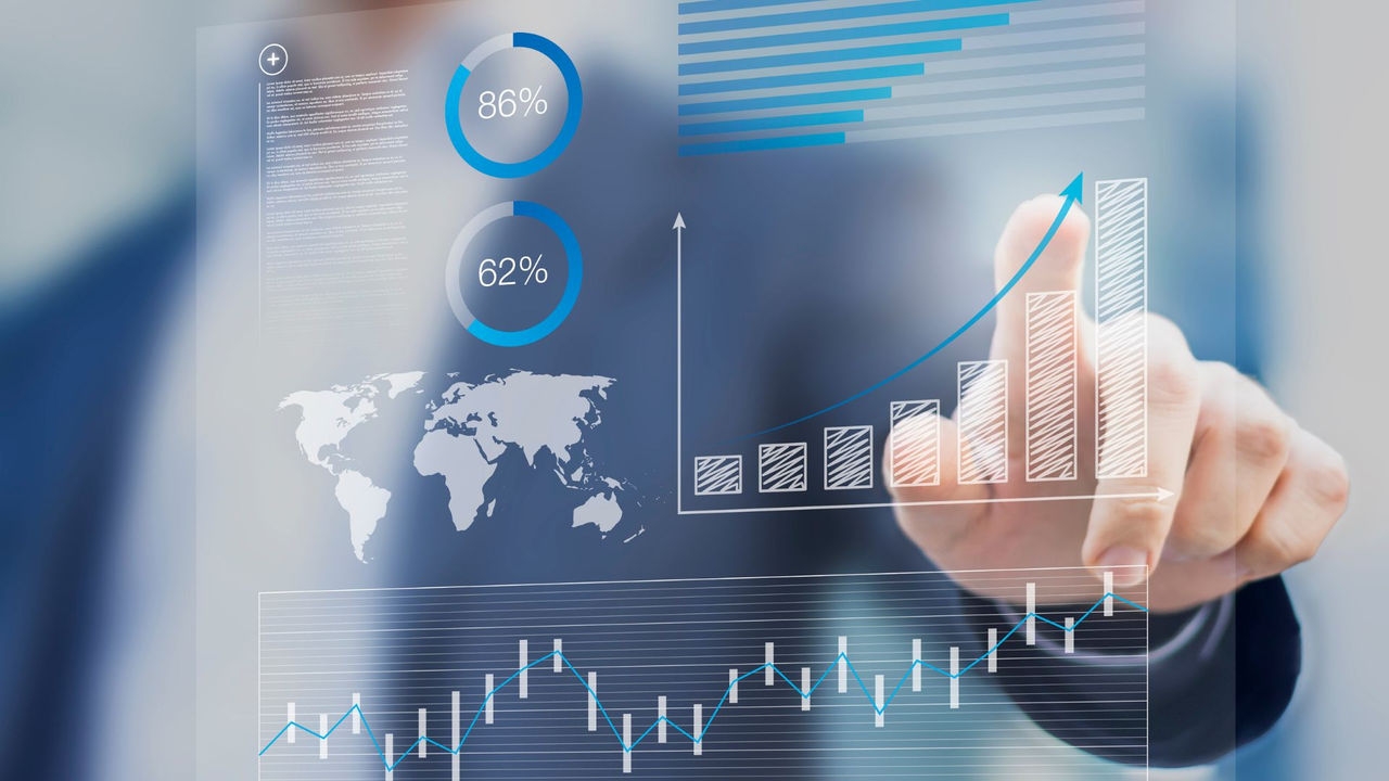 Businessman touching a virtual financial dashboard