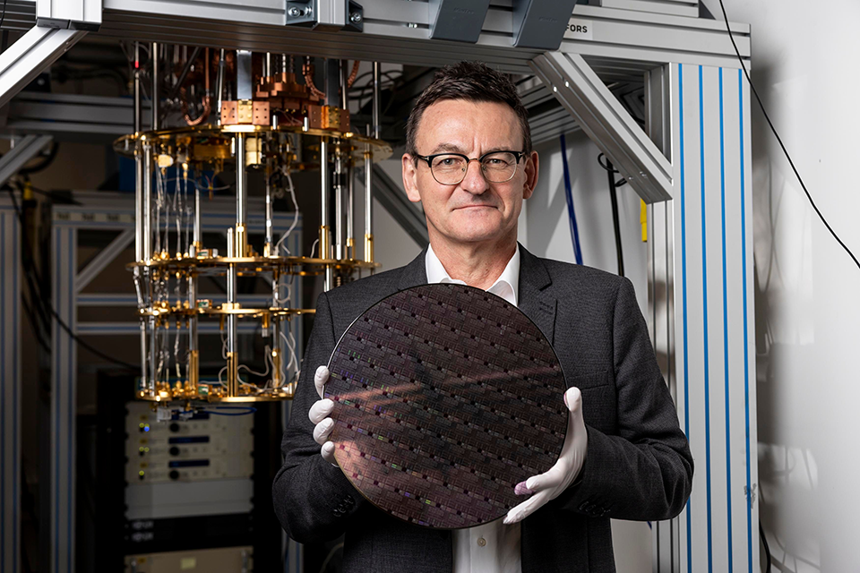 Diraq founder Professor Andrew Dzurak holds a silicon wafer. 