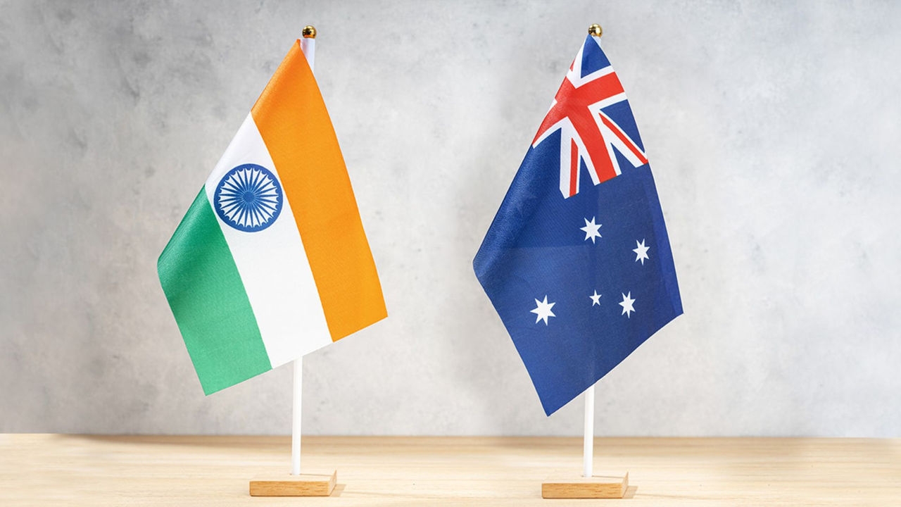 Flags of India and Australia on a desk
