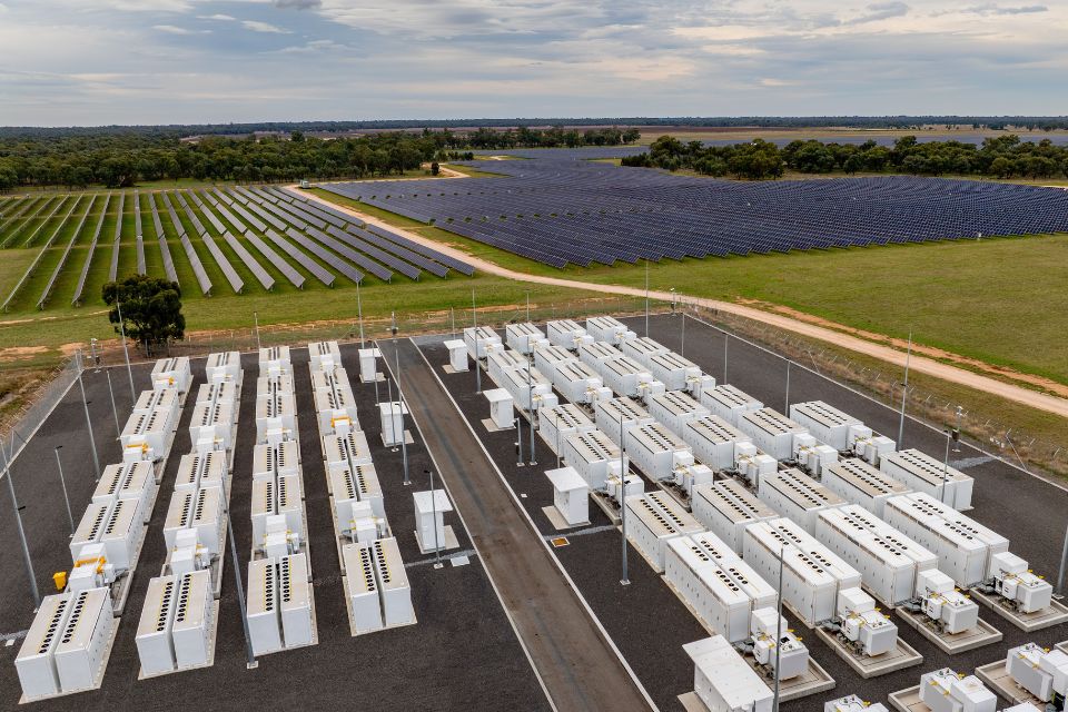 Darlington Point Big Battery Storage System with a solar farm in the background