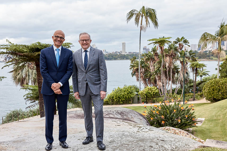 PM Albanese with Microsoft CEO Satya Nadella standing on foreshore of Sydney Harbour