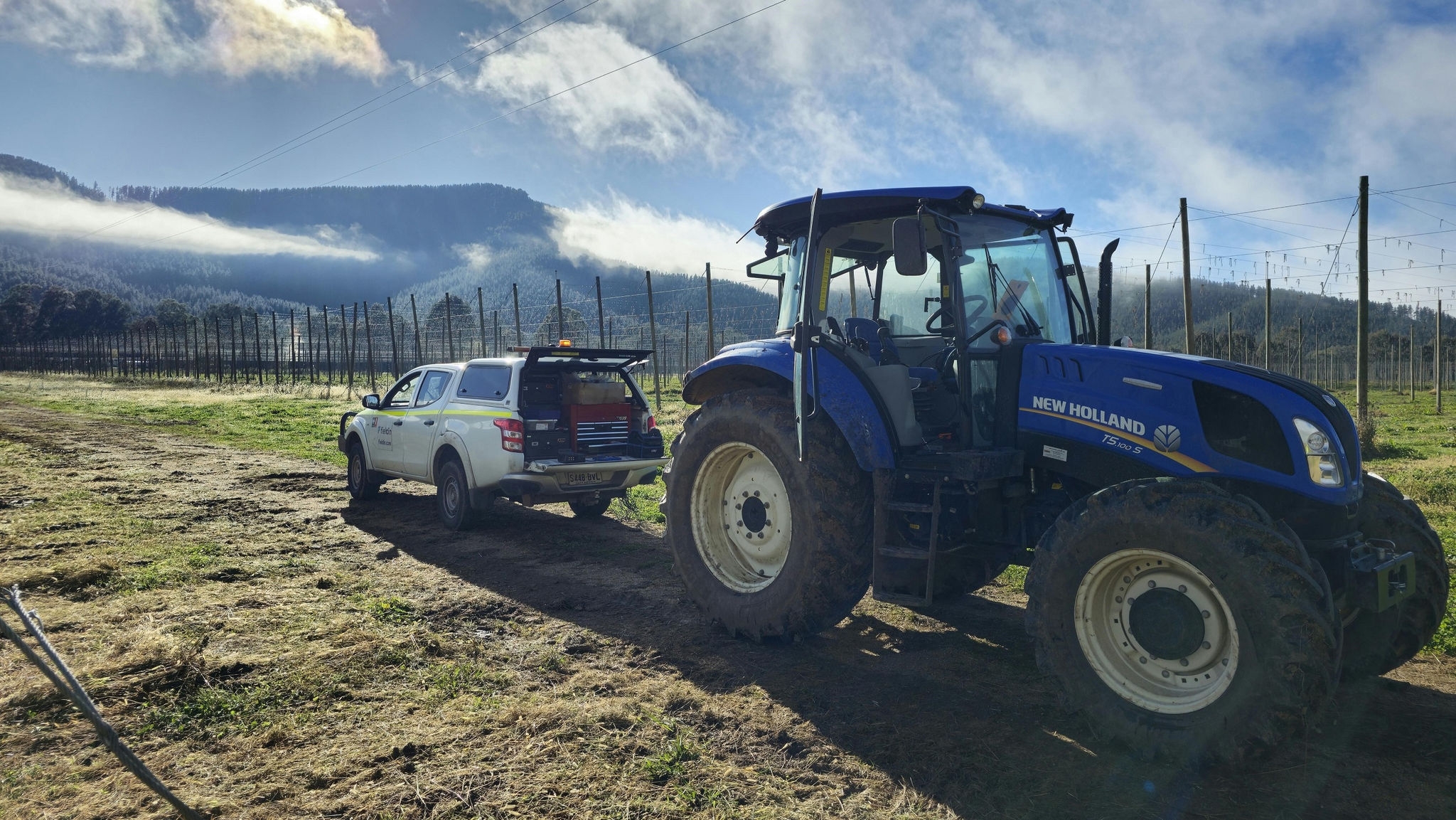 car and tractor on a farm