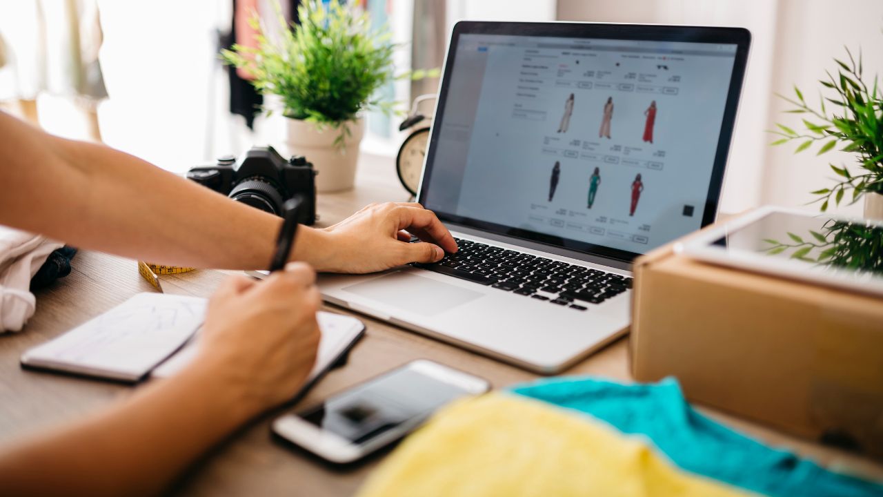 A creative professional using a laptop computer at a desk