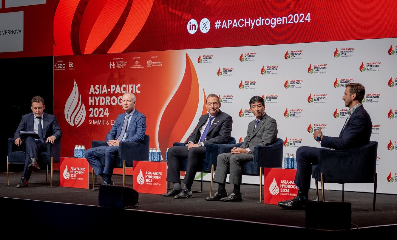 5 people on a stage talking at the Hydrogen Summit