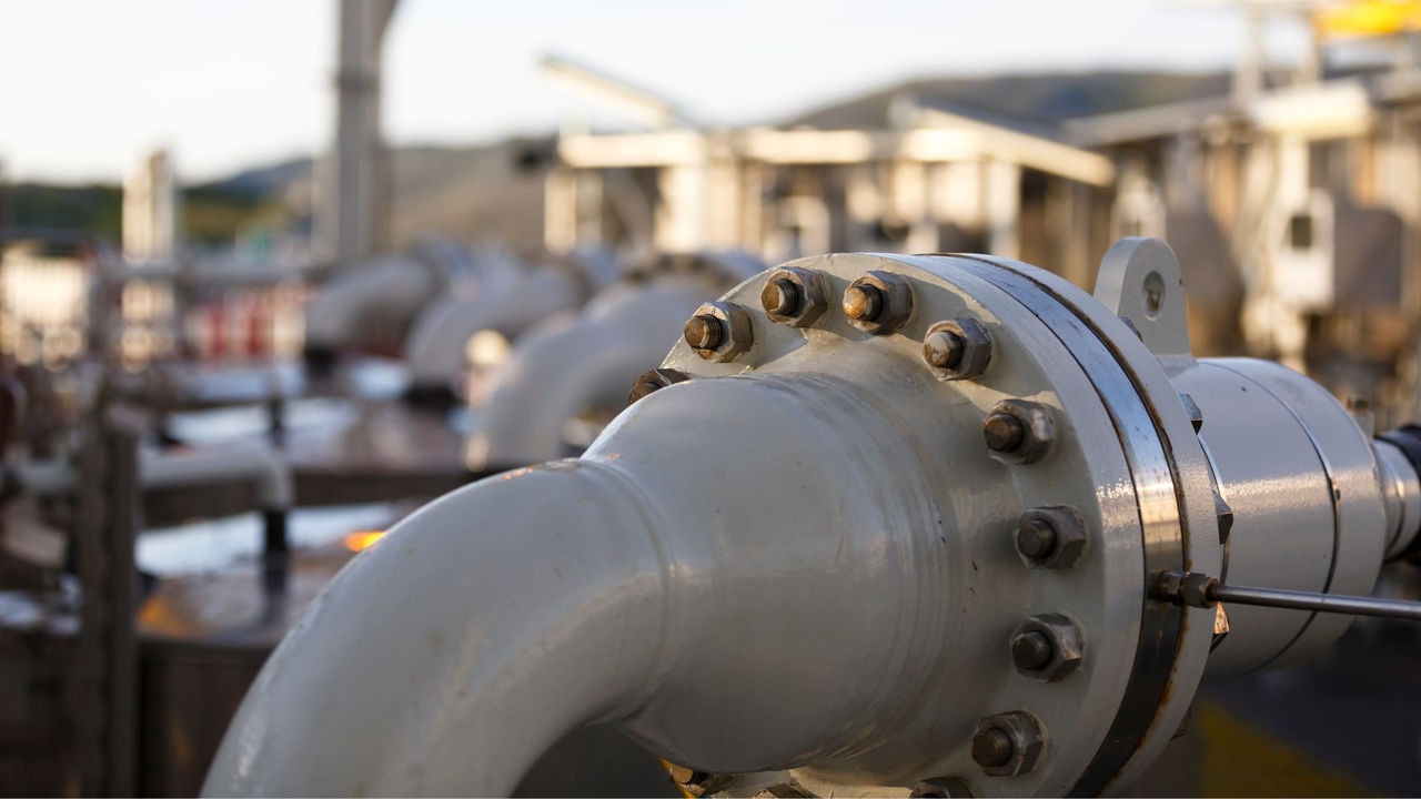 Flange and pipes in a processing facility