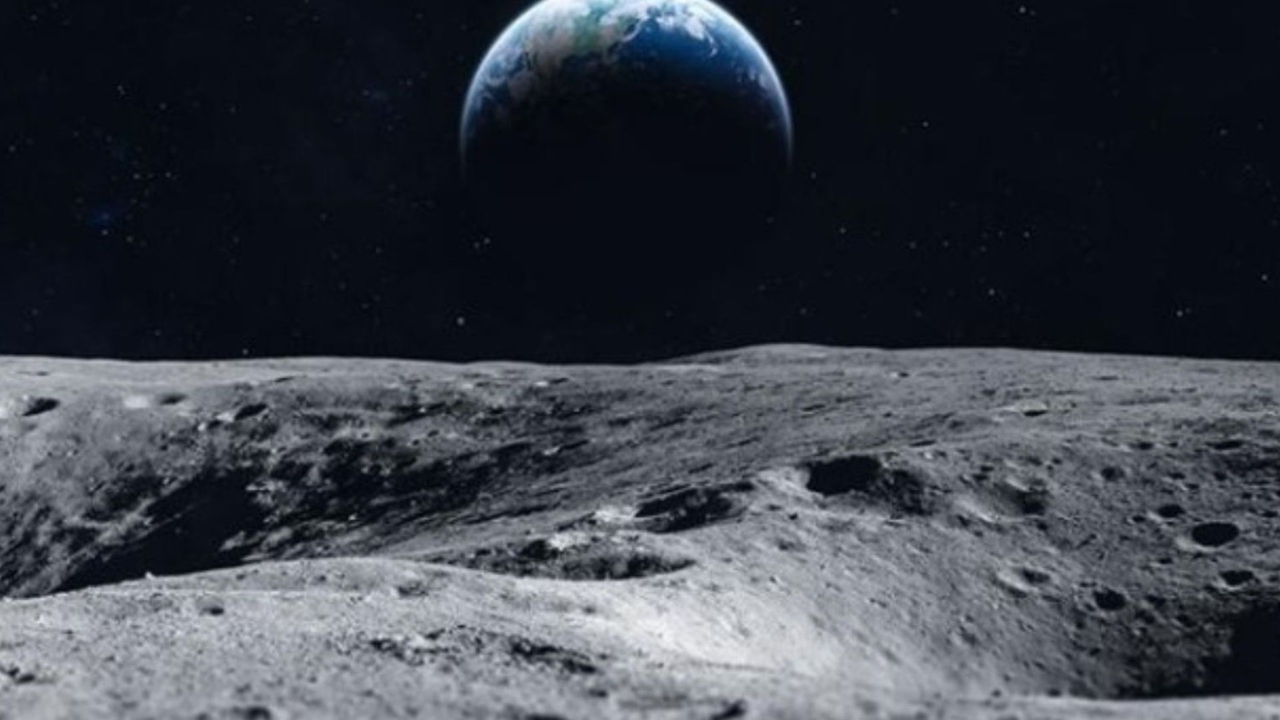 A view of the Earth rising over the Moon's horizon