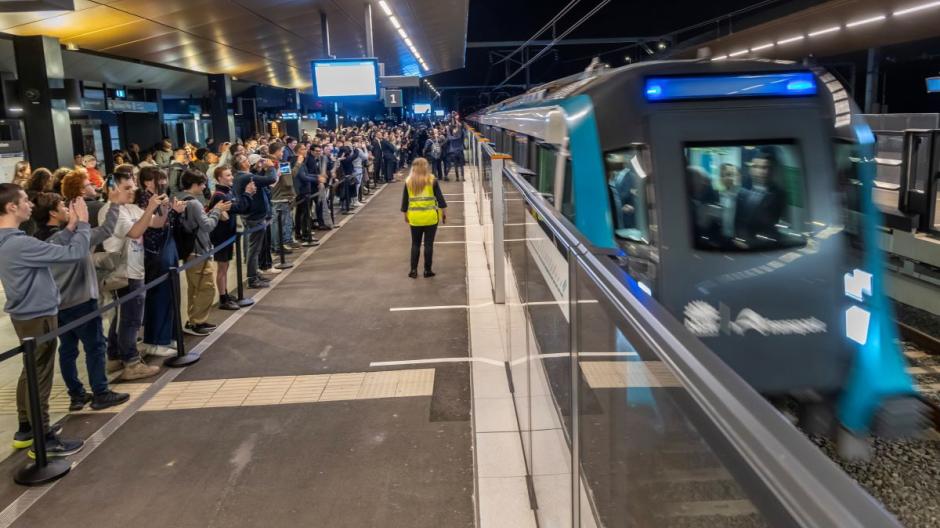 Train and commuters waiting at a station