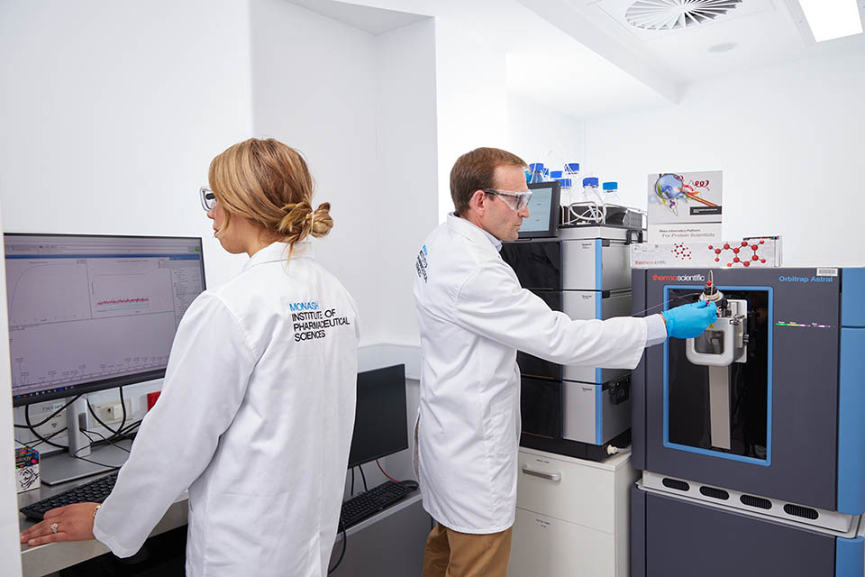 Two researchers in a lab using analytical technology