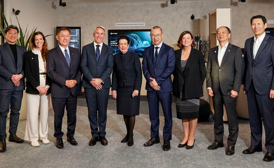 Group of 9 people standing together at the Innovation Centre Australia in Sydney
