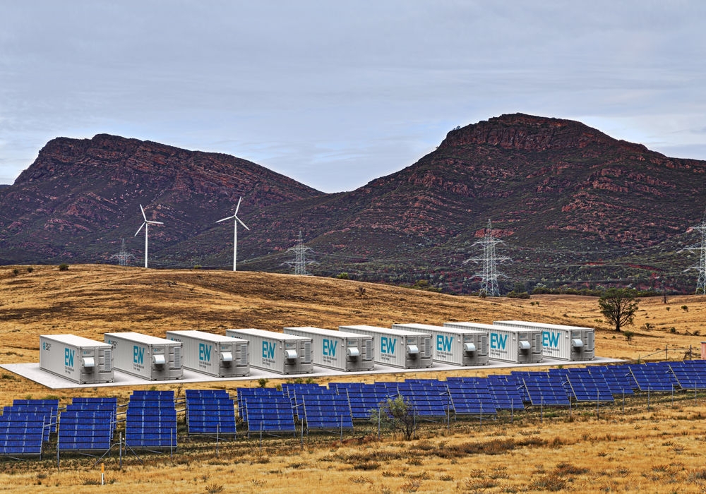  Large-scale iron flow batteries, solar panels and wind turbines outdoors on a large piece of land.