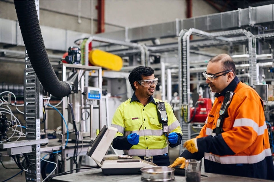 Two people working in demonstration facility
