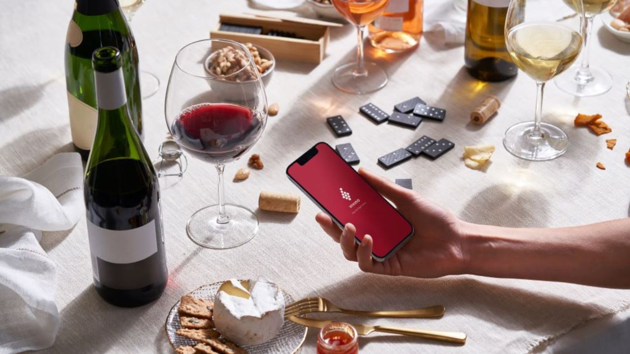 Dinner table with Vivino application on a mobile phone